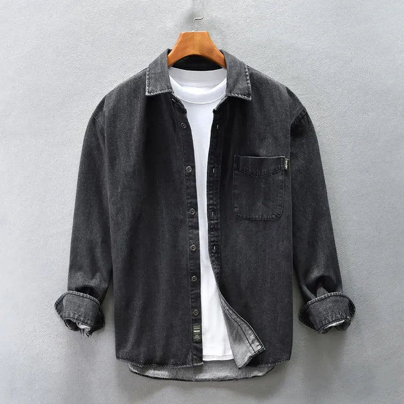 Classic men's blue denim button-up shirt, long sleeve, ideal for comfortable casual wear.