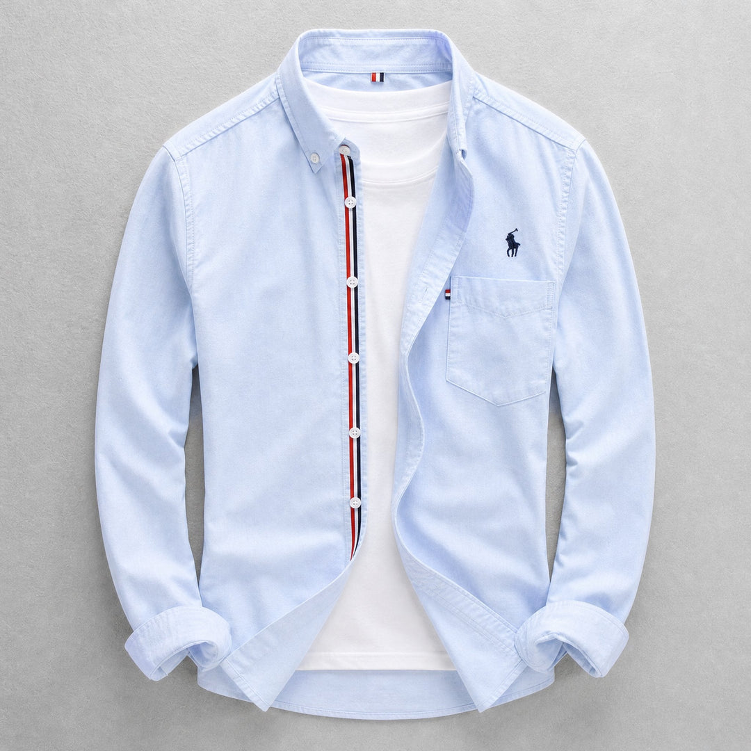Men's classic blue Oxford shirt, tailored fit, long sleeve button-down for smart casual & everyday wear. Versatile style.