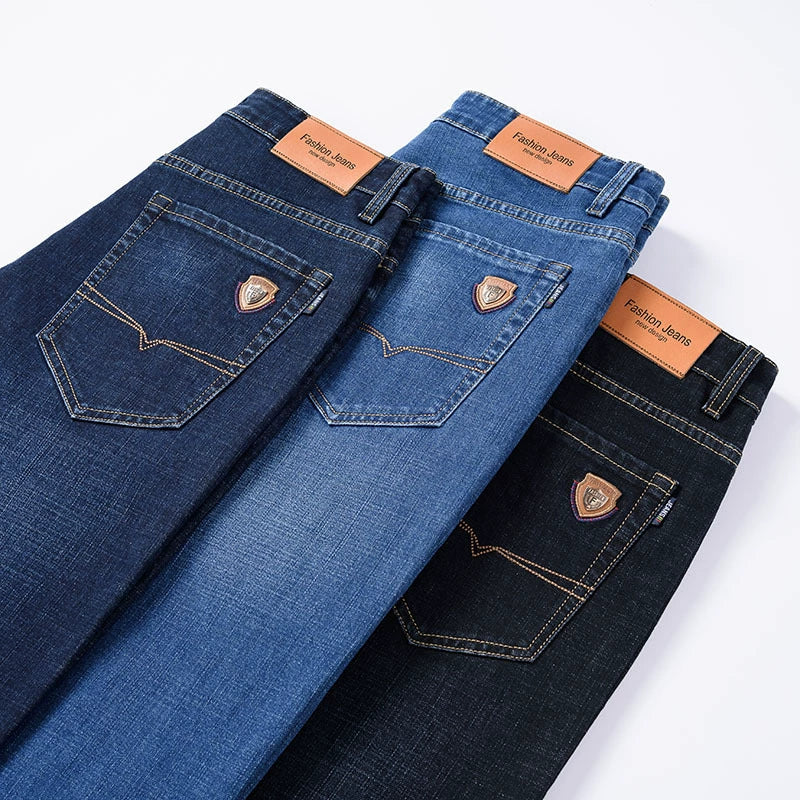 Men's classic blue stretch denim jeans paired with a belt, enhancing the versatile casual apparel look.