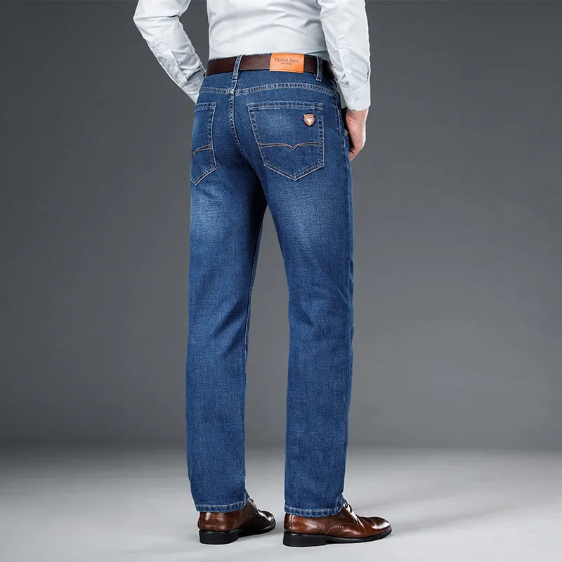 Back view of men's classic blue stretch denim jeans, durable, comfortable & casual men's apparel.