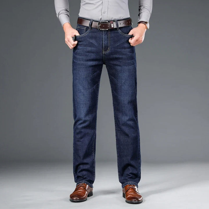 Side view of men's classic stretch denim jeans, structured fit for lasting comfort & stylish denim.