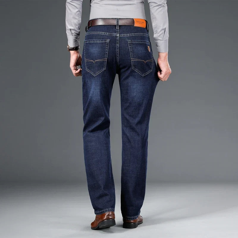 Close-up: Durable blue stretch denim fabric texture of men's classic jeans, high quality & comfort.
