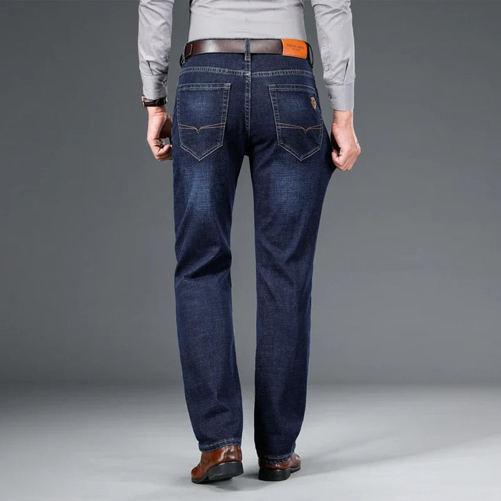 Close-up: Durable blue stretch denim fabric texture of men's classic jeans, high quality & comfort.