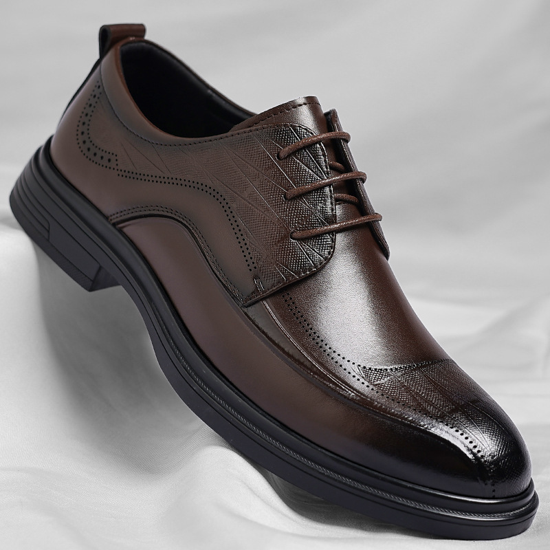 Men's classic brogue dress shoes in elegant leather, perfect for formal business attire.