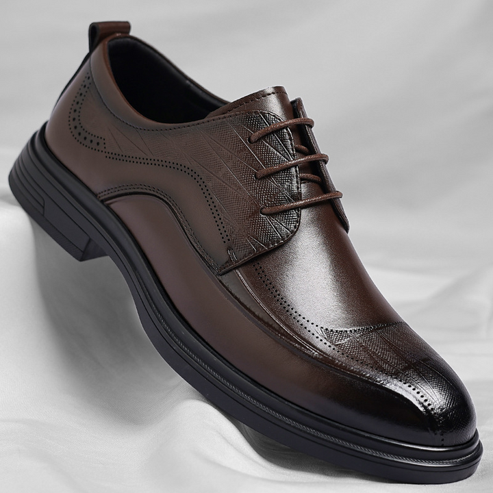 Men's classic brogue dress shoes in elegant leather, perfect for formal business attire.