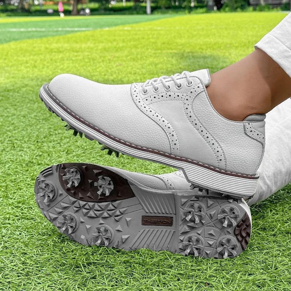 Side view of men's classic brogue spiked golf shoes, water-resistant leather for all-weather golf.