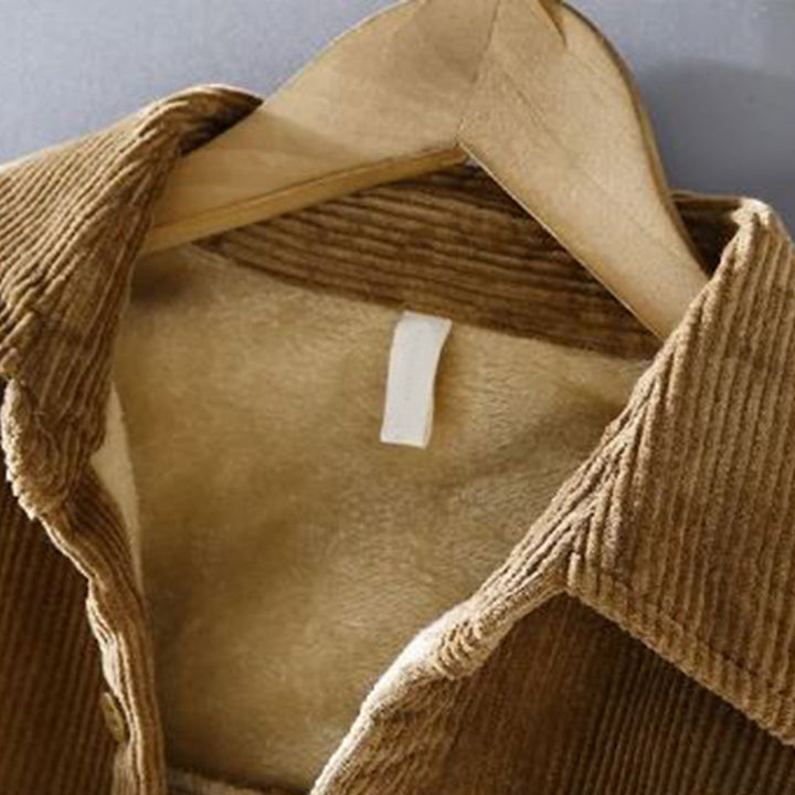 Rugged yet refined men's corduroy jacket, offering warm and stylish outerwear for a sophisticated fall outfit.