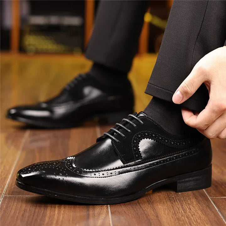 Close-up of brogue detailing on a classic men's leather oxford dress shoe, highlighting the sophisticated design.