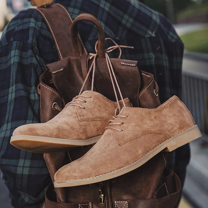 Men's classic brown leather lace-up Derby shoes, perfect for versatile dress or casual everyday wear. Effortless style.