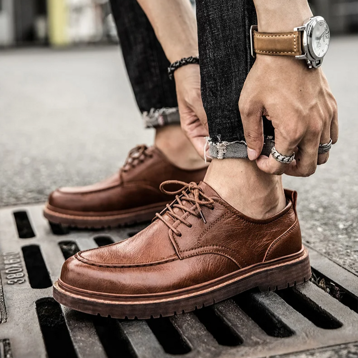 Brown leather men's classic Derby shoes, lace-up style for formal & casual wear. Stylish, durable, comfortable footwear.