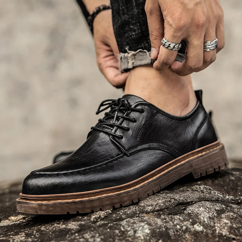 Men wearing classic brown lace-up Derby shoes, styled for a smart casual look. Comfortable & versatile footwear.