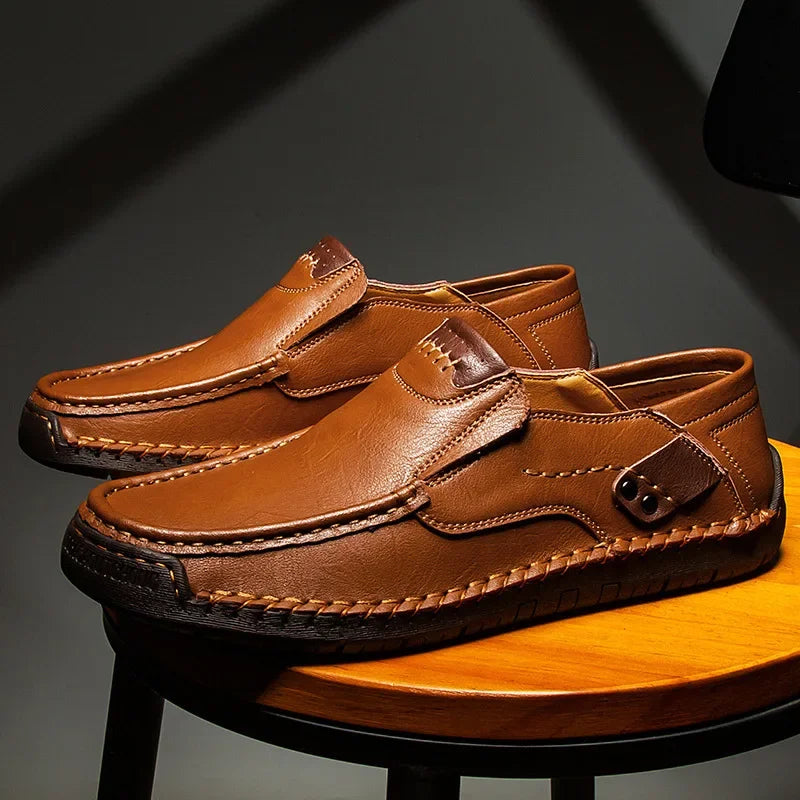 Men's classic brown leather loafers for refined everyday style, comfortable slip-on dress shoes.