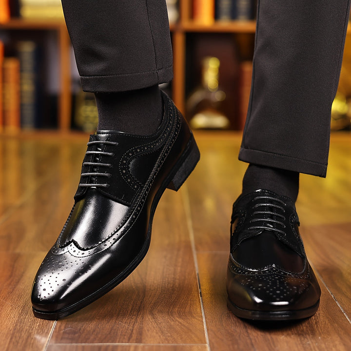 Stylish men's leather Oxford brogue dress shoes with sophisticated wingtip detailing, perfect lace-up formal footwear.