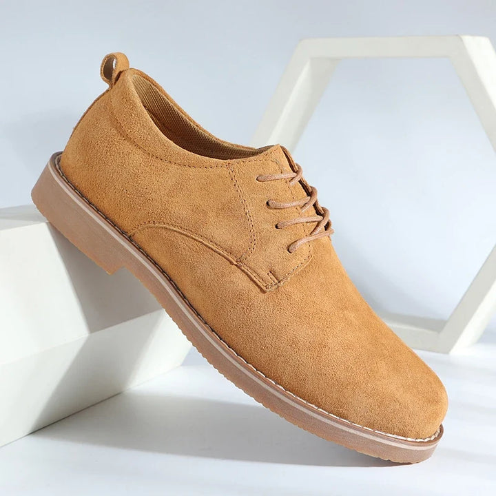Men's classic brown leather Oxford shoes, versatile for dress or casual style, durable and comfortable everyday footwear.