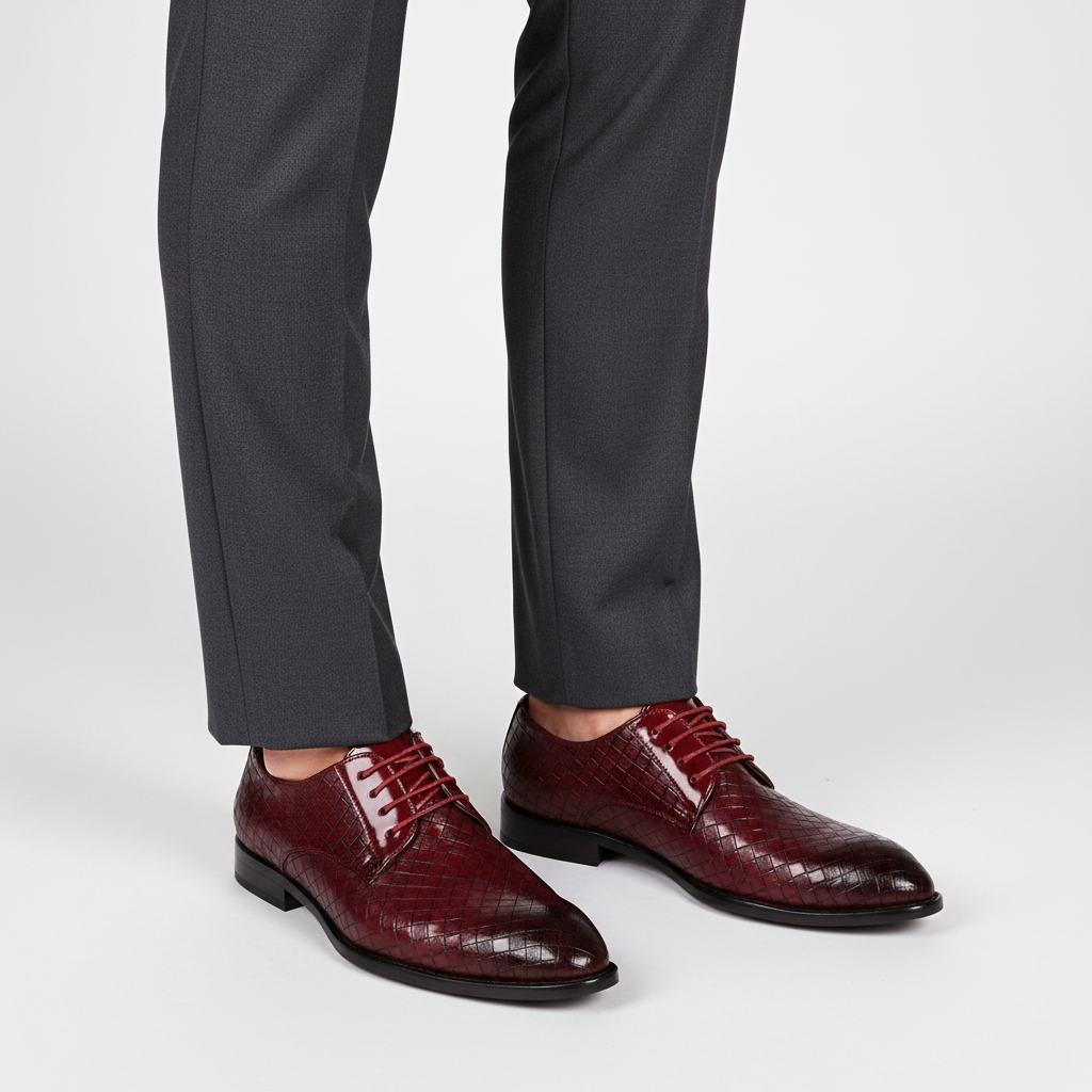 Close-up of men's black leather oxford shoes, highlighting the intricate lacing and classic design