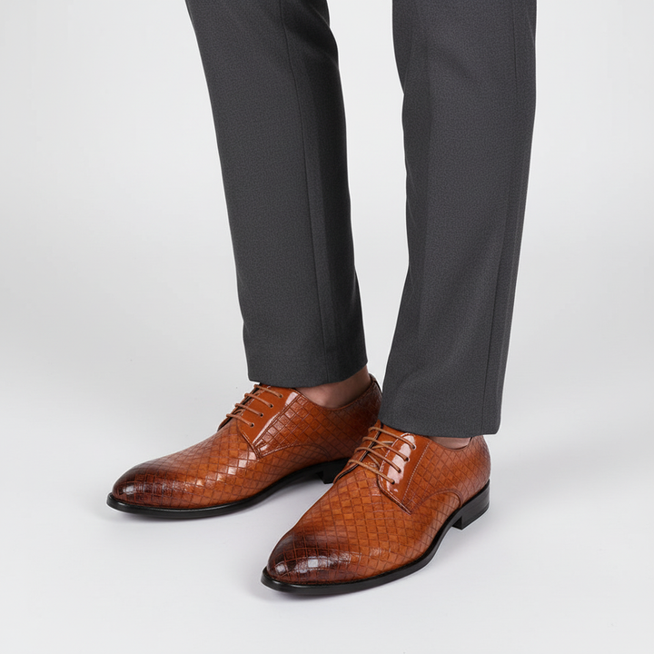 Detail of the fine leather and precise lacing on men's classic oxford dress shoes