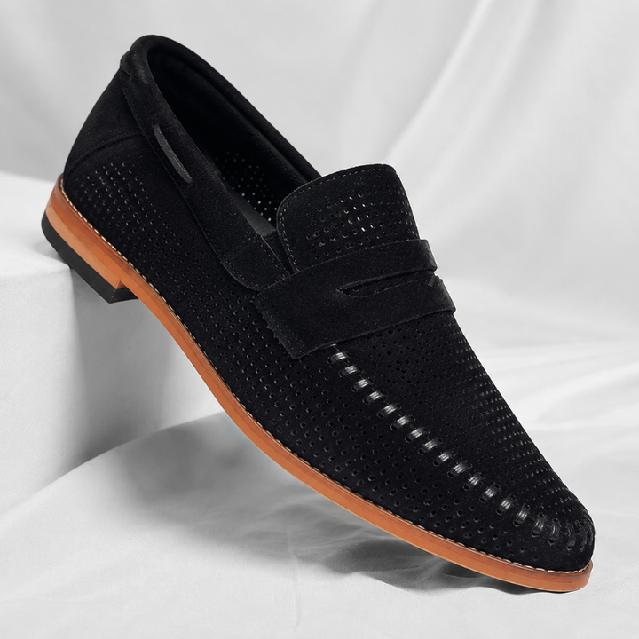 Stylish men's black penny loafers, offering a comfortable and professional slip-on footwear option.