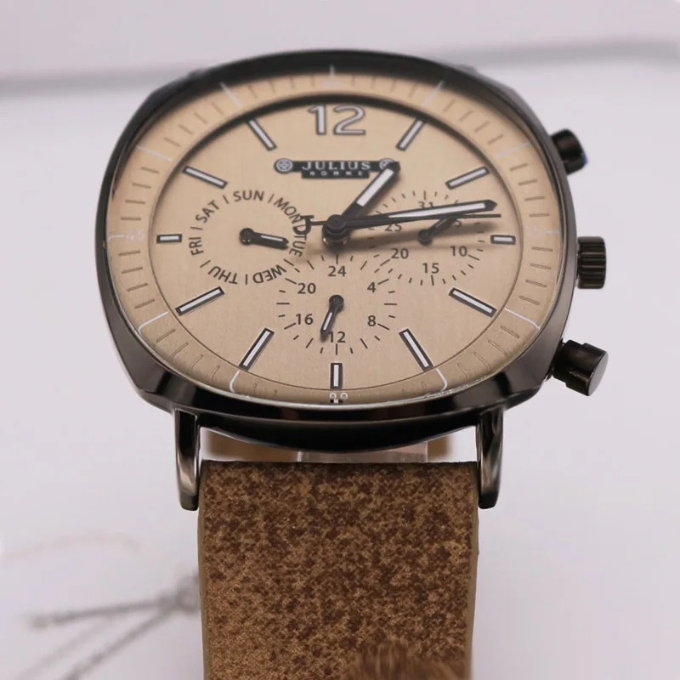 Lifestyle shot: Men's multi-function watch on a desk, a stylish and practical timepiece for the modern man.