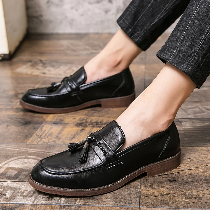 Stylish brown men's tassel loafers, an essential formal shoe for business and smart attire.