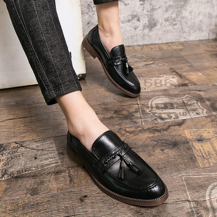 Classic leather men's tassel loafers, perfect formal shoes for business meetings or evening events.