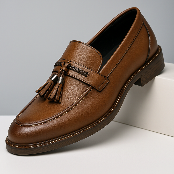 Men's classic brown leather tassel loafers, ideal for sophisticated business or casual wear.
