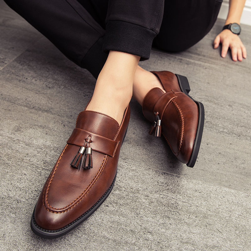Sophisticated men's slip-on tassel dress shoes, perfect for formal or business casual wear.