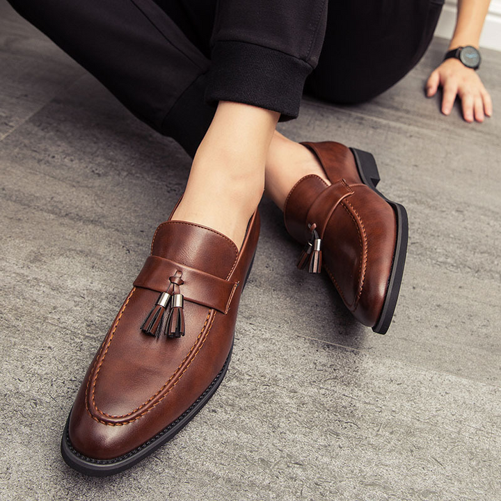 Sophisticated men's slip-on tassel dress shoes, perfect for formal or business casual wear.