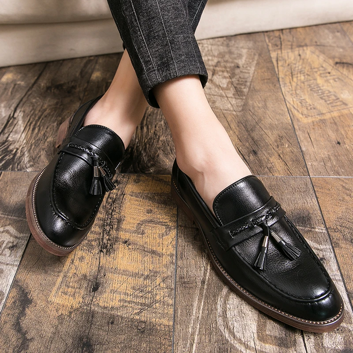 Sophisticated men's casual footwear: stylish tassel loafers offering comfort and polished appeal.