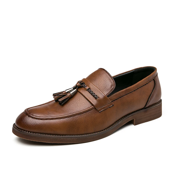 Polished men's tassel loafers, ideal for adding a sophisticated touch to any formal or casual outfit.
