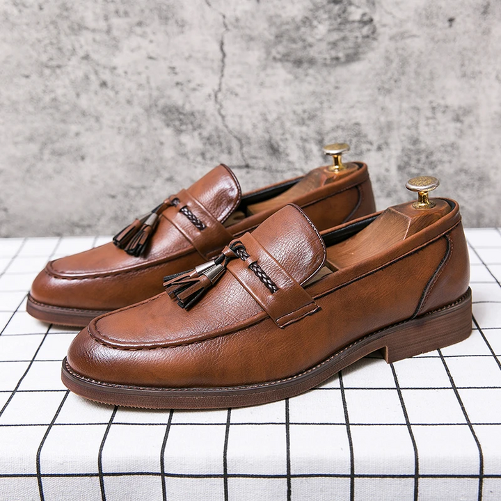 Polished men's slip-on tassel loafers for all-day comfort and timeless formal style.