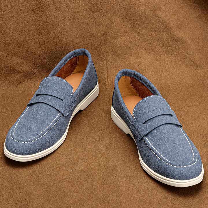 Stylish blue men's penny loafers, slip-on comfort shoes for a modern casual look & versatile everyday wear.