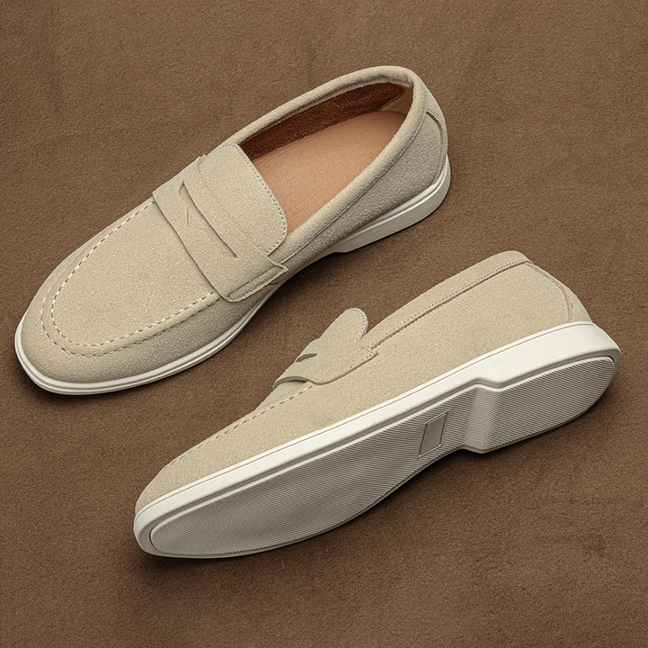 Easy slip-on men's penny loafers in rich brown, offering ultimate comfort & classic style for everyday versatile wear.
