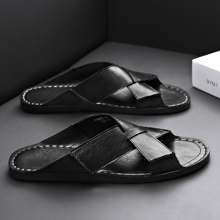 Stylish black men's slip-on comfort sandals, a versatile choice for modern casual summer fashion.