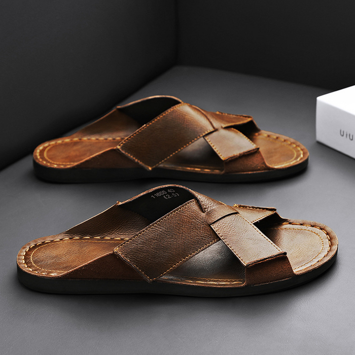 Textured brown men's slip-on comfort sandals with a durable strap, great for casual summer footwear.