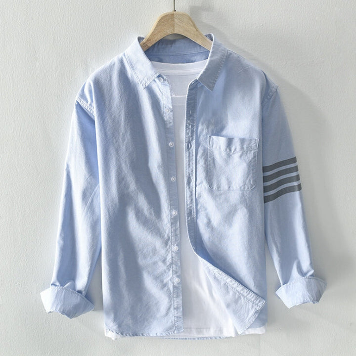 Men's classic button-up long sleeve shirt, perfect for everyday casual wear. Versatile style.