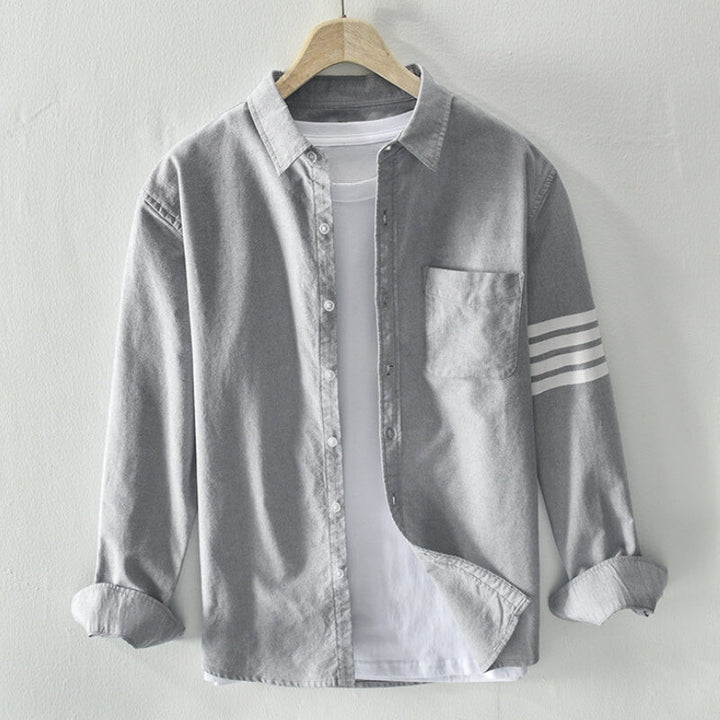 Stylish men's long sleeve button-up shirt, a casual and classic collared top for everyday comfort.