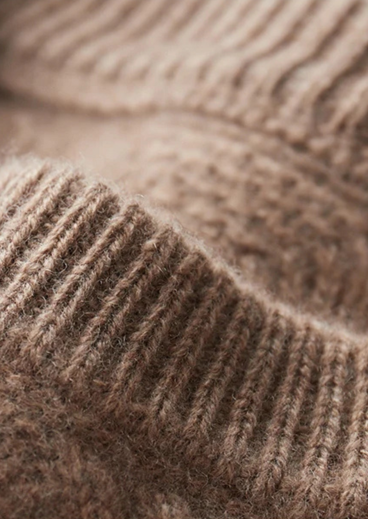Textured cable knit men's sweater, crew neck. Provides warmth and classic style for cold winter days.