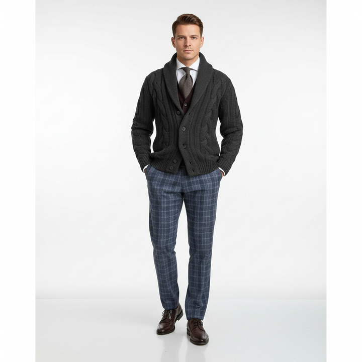 Close-up of men's cable knit vest texture, showing intricate knitted pattern and wool blend