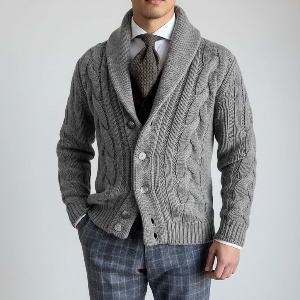 Fashionable man pairing a dark cable knit vest with jeans, suitable for casual winter outfits