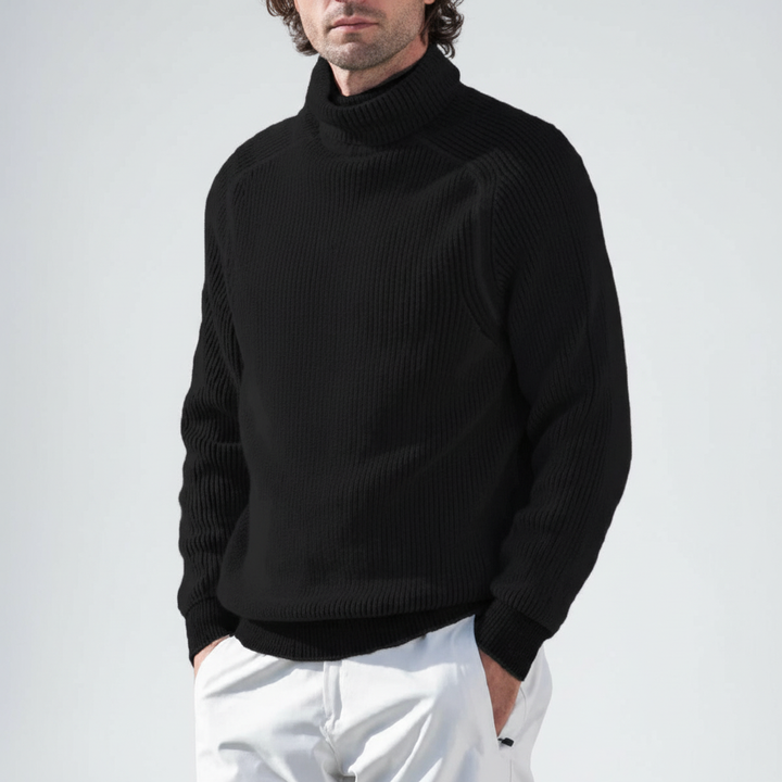 Product shot of a folded men's warm ribbed cottonblend turtleneck sweater, ready for casual wear