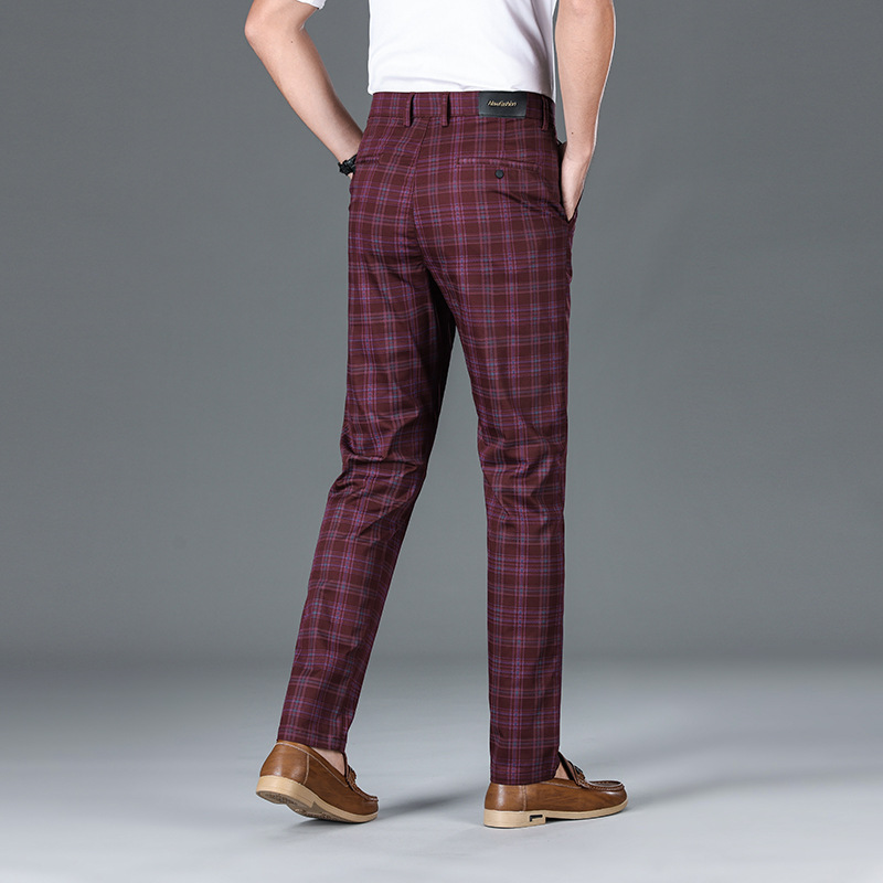 Men's classic check trousers paired with a blazer, showcasing smart casual & sophisticated men's fashion.