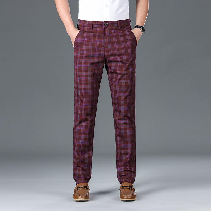 Close-up of men's classic check trousers fabric, highlighting comfortable cotton blend and intricate plaid.