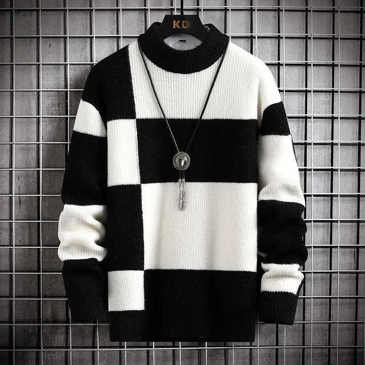Cozy men's turtleneck sweater with a stylish checkered block pattern. Versatile for smart casual or relaxed winter outfits.