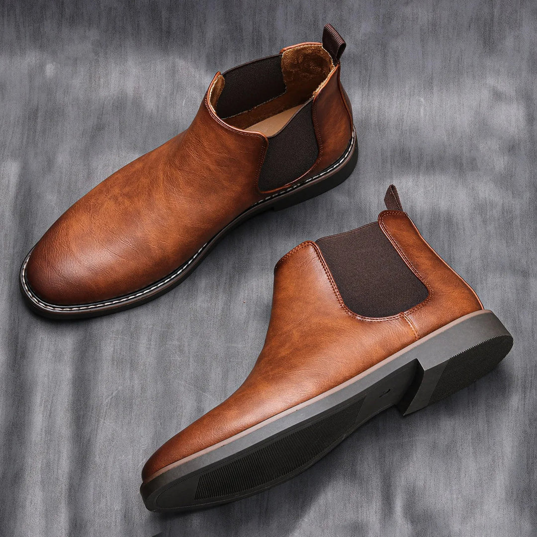 Rich brown leather men's Chelsea boots, sleek profile, ideal fall & winter fashion for men.