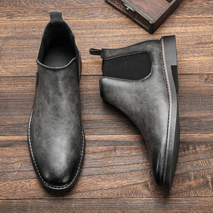 Men's winter Chelsea boots, warm & durable, classic design for cold weather comfort & style.