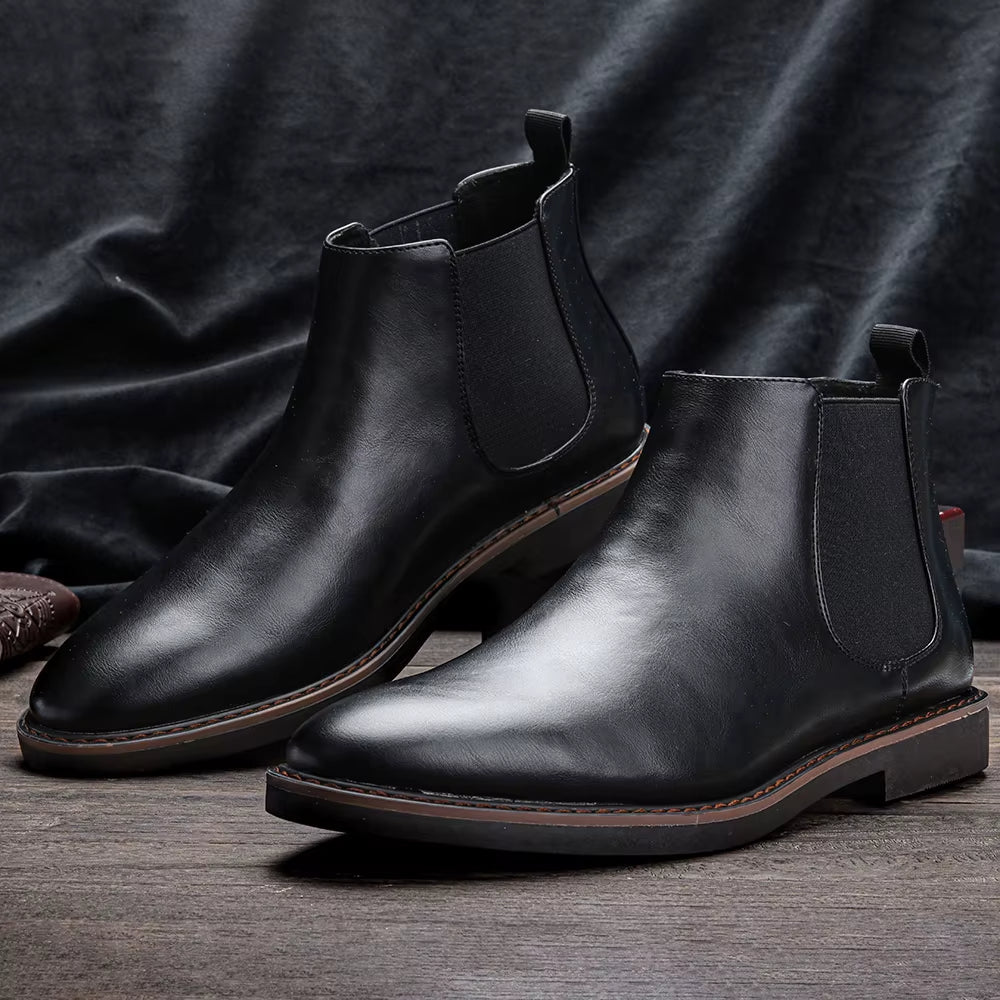Front angle of men's black Chelsea boots, pointed toe, sleek & sophisticated dress footwear.