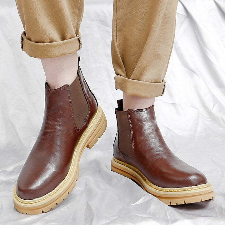 Elegant black Chelsea boots for men, comfortable slip-on fashion footwear with a timeless classic style.