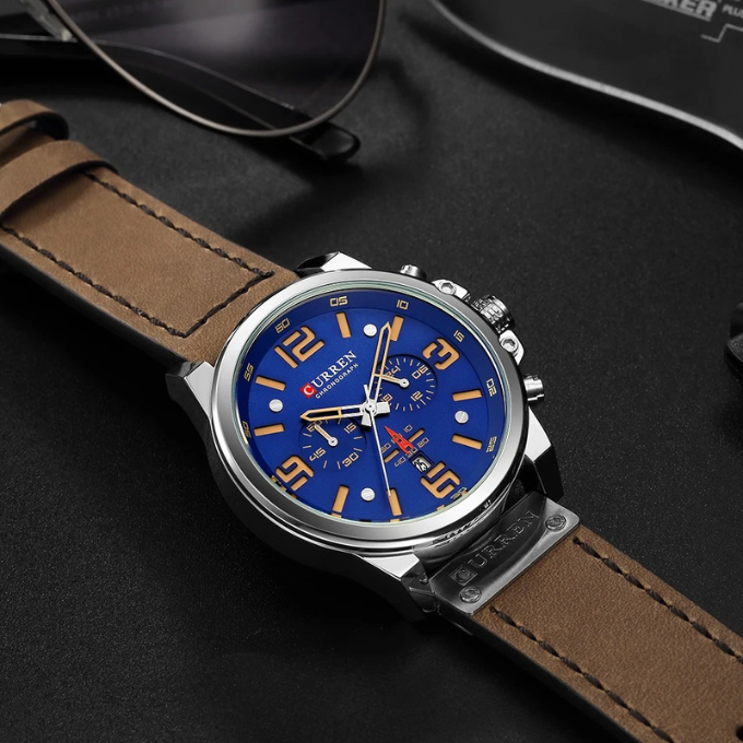 The Hudson Men's Watch: an elegant chronograph with a black leather band & polished stainless steel bezel.