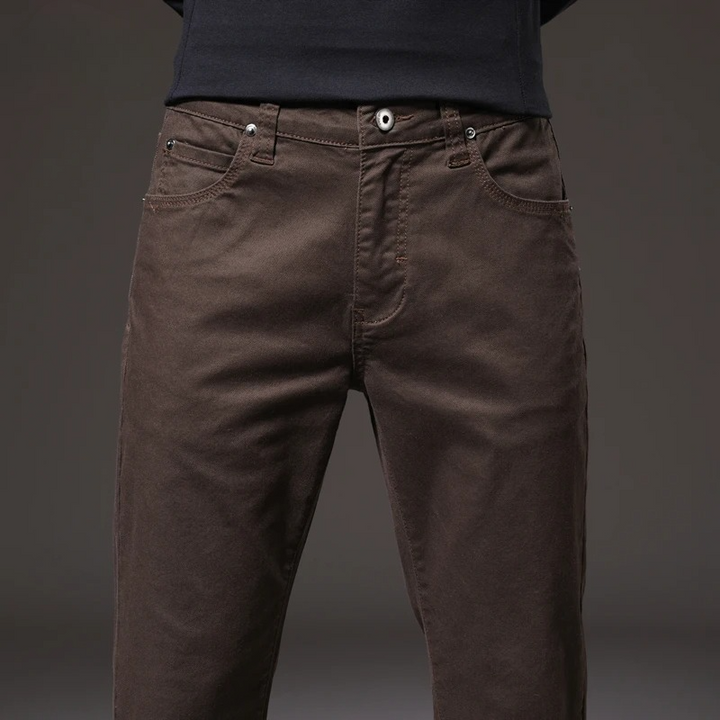 Khaki men's classic cotton chino trousers, comfortable and stylish for everyday casual outfits.