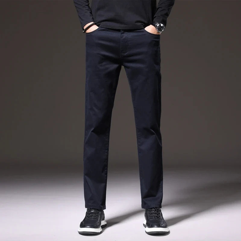 Versatile men's classic cotton chino trousers in khaki, brown, & navy; comfortable for casual outfits.
